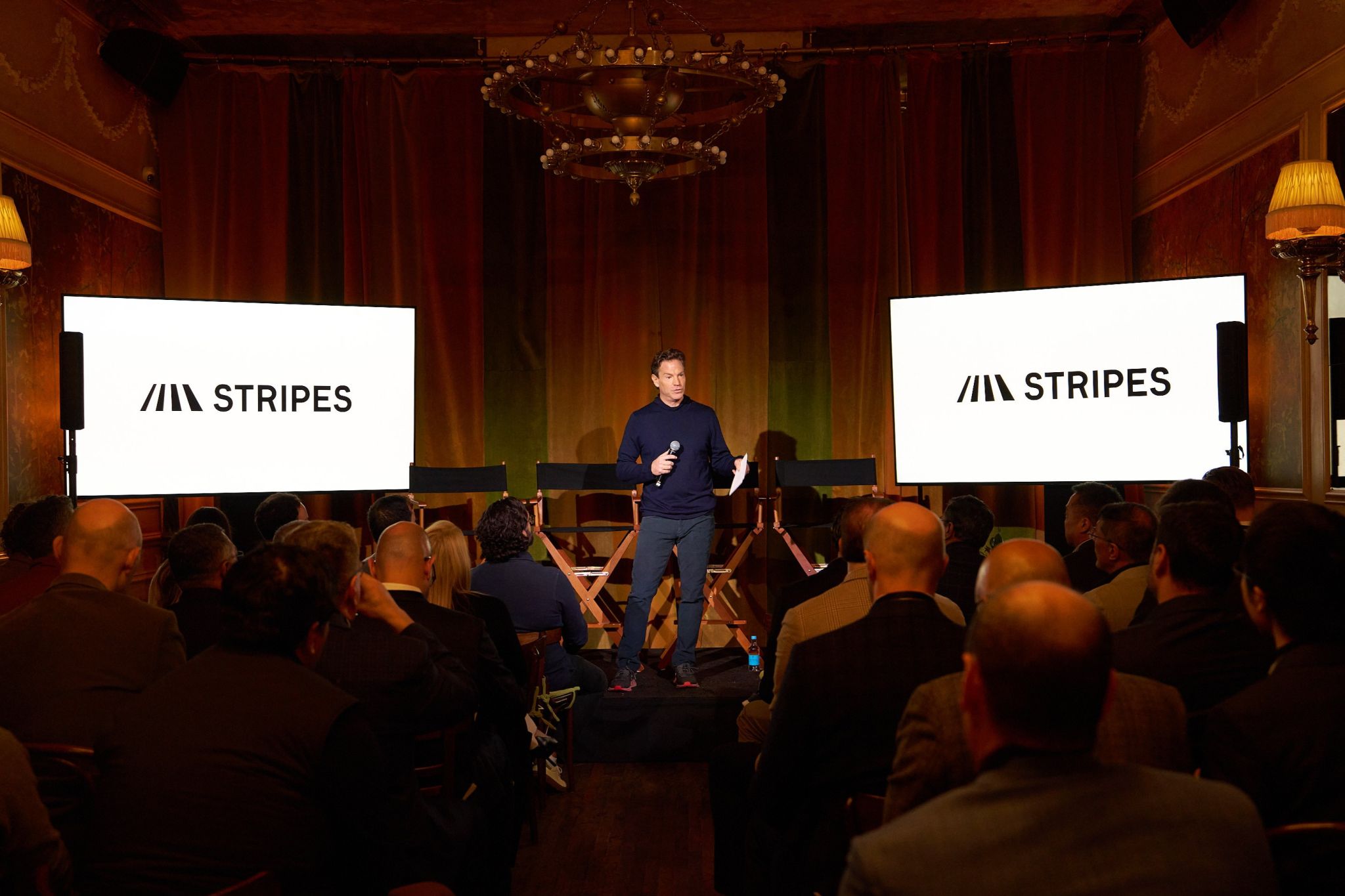 A speaker on stage at the Stripes Tech Summit