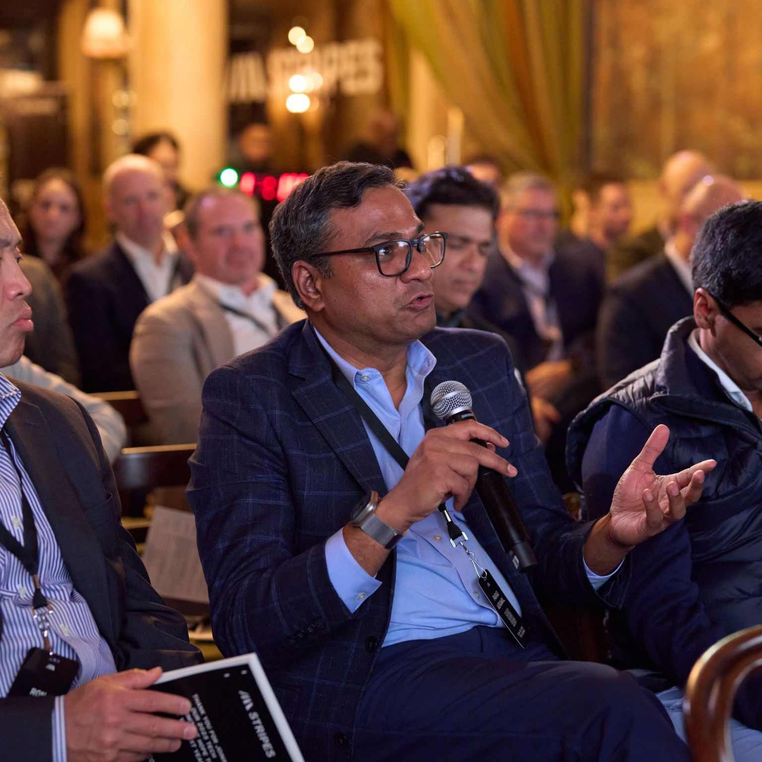 A panel conversation in front of the audience